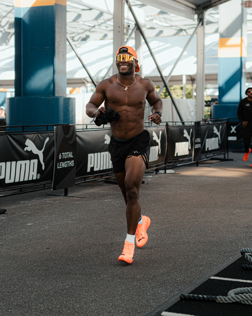 Coach is running with a big smile.